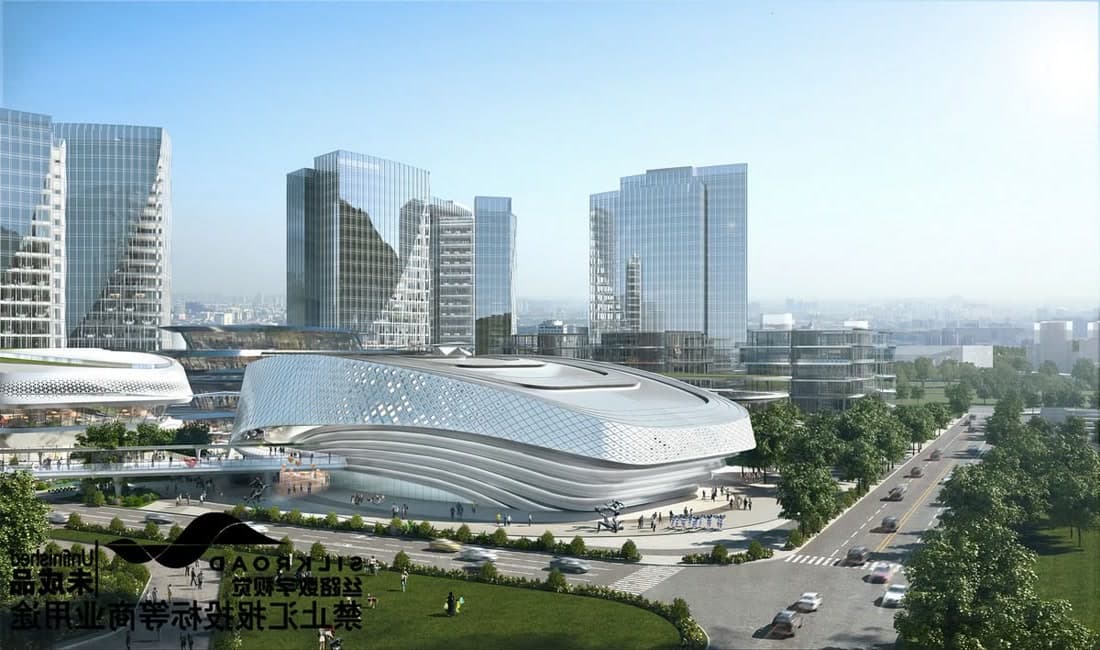A stadium and arena district beside a city skyline