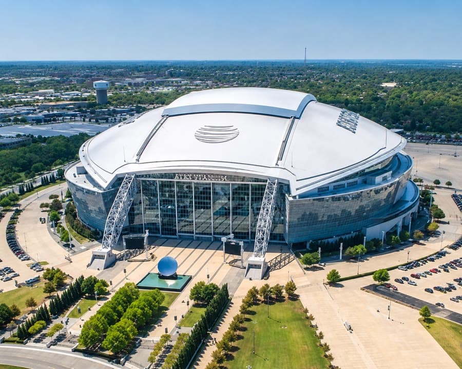 An aerial view of a domed stadium and its forecourt